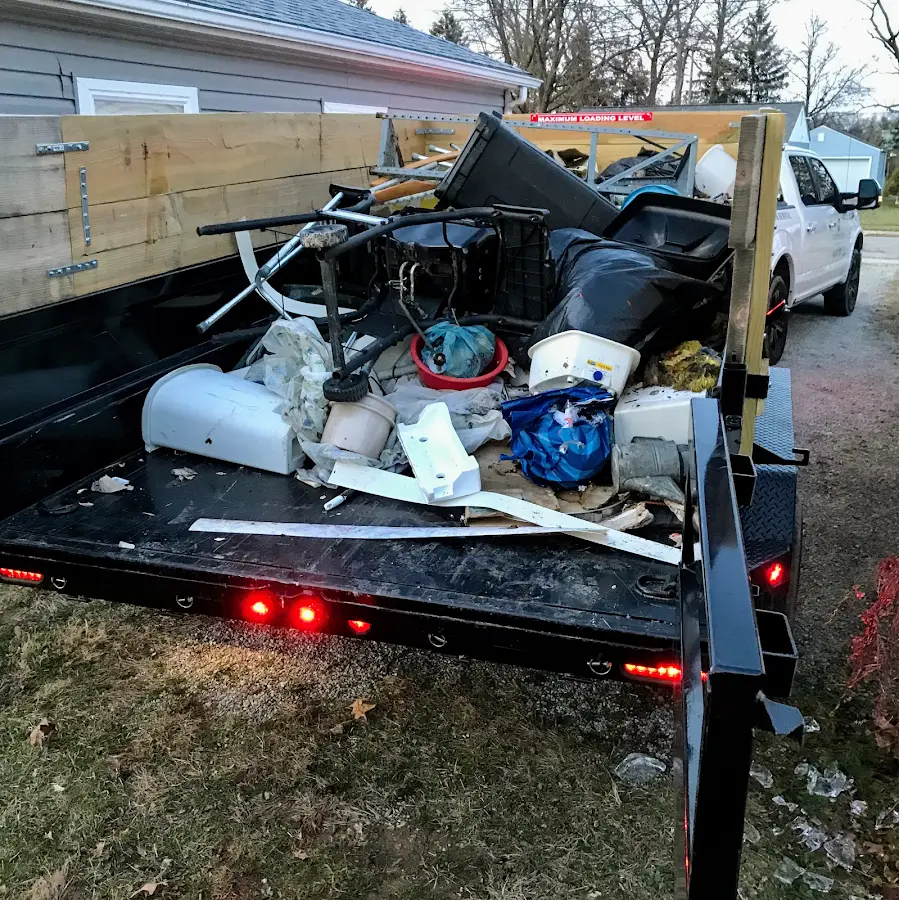 Roll-off dumpster delivered to a residential driveway in Petoskey